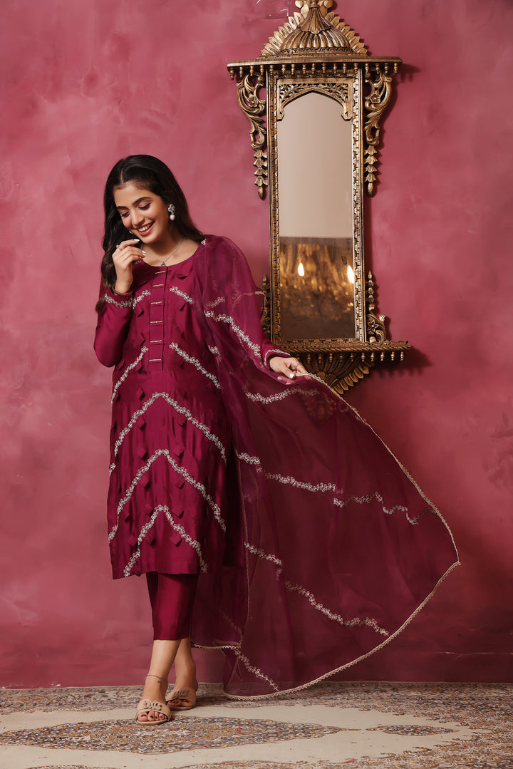  Crafted from pure sheesha silk, this milange outfit features pleated stitching, minimal embroidery, and exquisite pearl and bead work on the back.