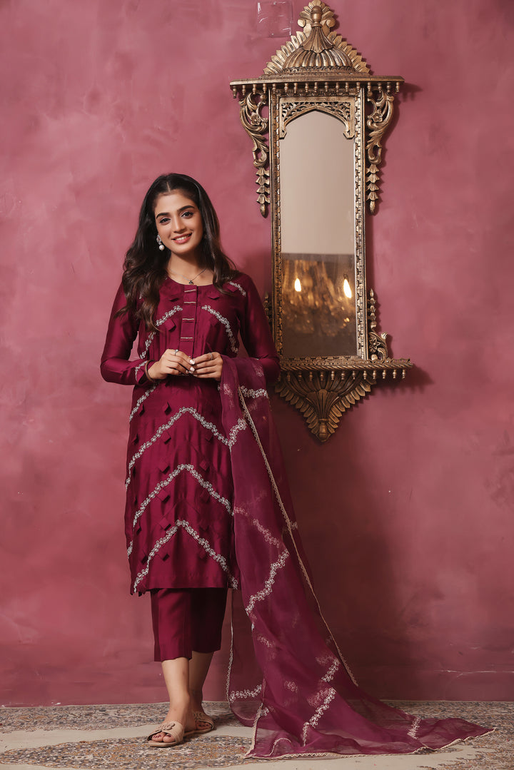  Crafted from pure sheesha silk, this milange outfit features pleated stitching, minimal embroidery, and exquisite pearl and bead work on the back.