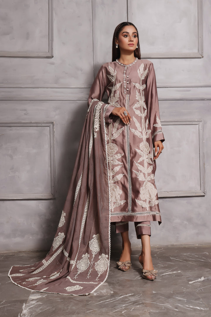  Embrace classic style with Esmee by Mona Imran, featuring unique applique embroidery on pure silk for an elaborate Eid look.