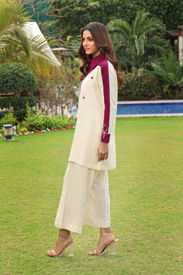 Embrace the charm of COCO. Cotton net with pearls, Swarovski work, radiant stones in a chic front open style. Choose palazzo or straight pants for Eid.