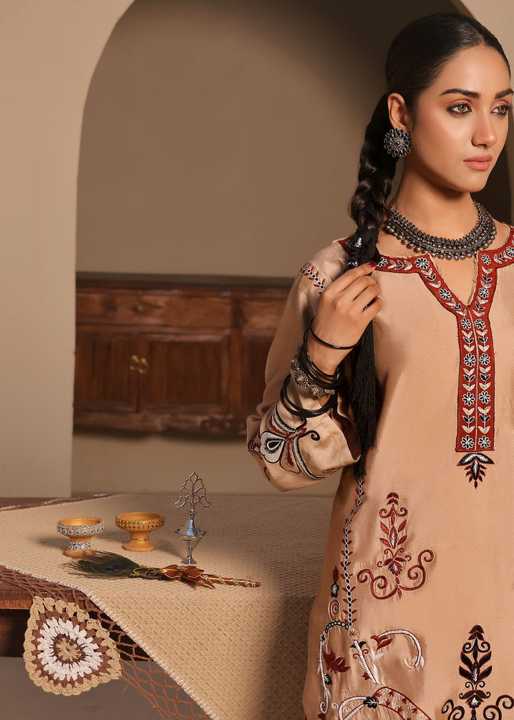  Discover Maya by Mona Imran, featuring intricate Kashmiri handwork on the neckline, daman, sleeves, and back for an elegant look.