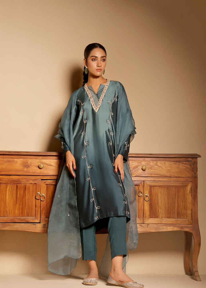  Introducing ARZU by MONA IMRAN. Elegant long-length panelled shirt with intricate neckline applique and delicate stone embellishments. Ideal for all occasions.