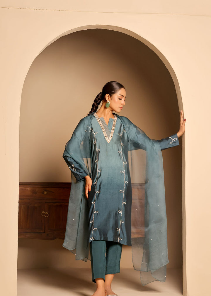  Introducing ARZU by MONA IMRAN. Elegant long-length panelled shirt with intricate neckline applique and delicate stone embellishments. Ideal for all occasions.